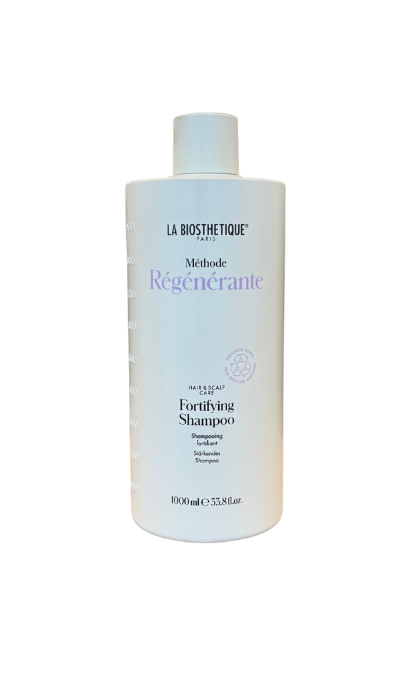 White bottle of La Biosthétique Fortifying Shampoo on a black background with purple 'Régénérante' text on the label.