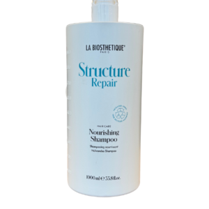 La Biosthetique Structure Repair Nourishing Shampoo bottle, white with blue text, centered against a black background.