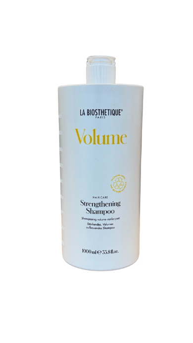 White bottle of La Biosthétique Volume Strengthening Shampoo on a black background (1000 ml).